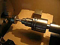 Drill square holes in metal? |  A 3-tooth gearwheel on the drill chuck, engaging the inside of a stationary...