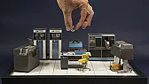 Scratch-built IBM 1401 computer room diorama in miniature |  The detail that grabbed me first is a human hand holding a single tiny tape reel...